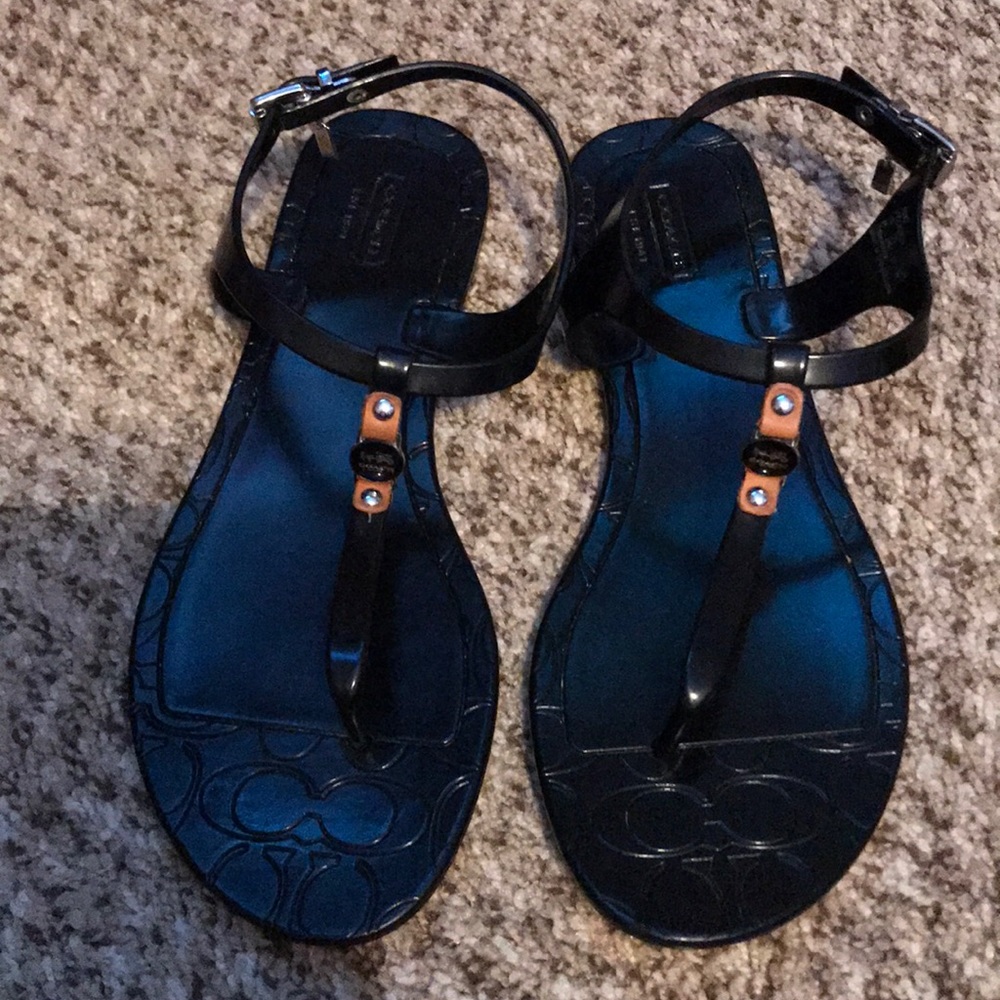 Gently worn, black jelly Coach sandals